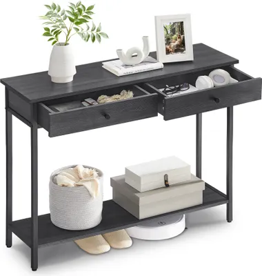 A dark gray console table with two drawers, a lower shelf, and decorative items.