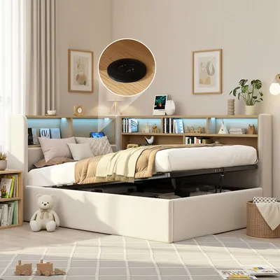 A bedroom scene with a bed that has storage space underneath and a headboard with shelves and lights.
