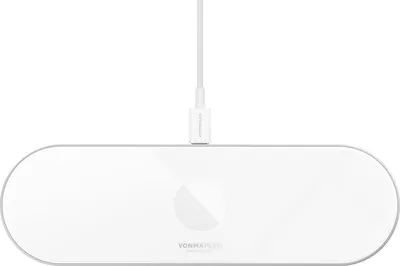 A white wireless charging station with a white USB-C cable plugged into it, shown from a top-down perspective on a white background.