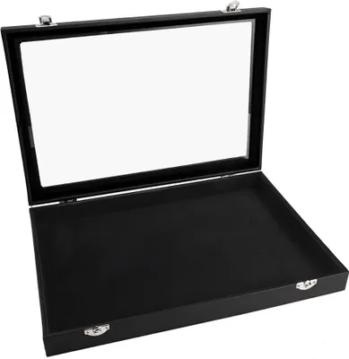 An open black jewelry box with a clear glass lid, shown against a white background.