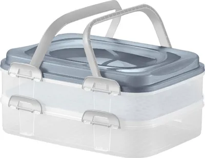 A clear, professional studio shot of a two-tiered plastic cake carrier with a gray lid and handles.