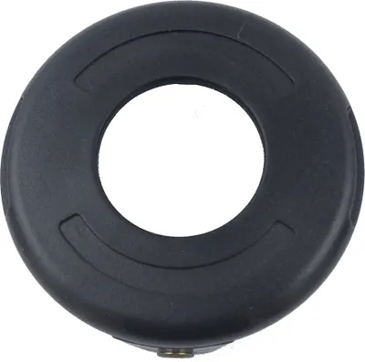 A black circular object with a hole in the center, likely a spare part for a garden tool.