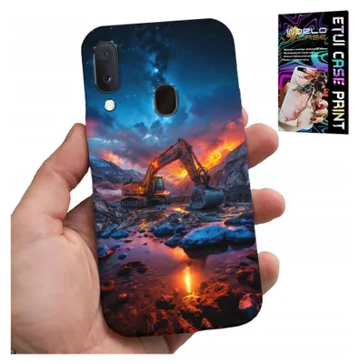 A hand holding a phone case with a printed image of an excavator at sunset.