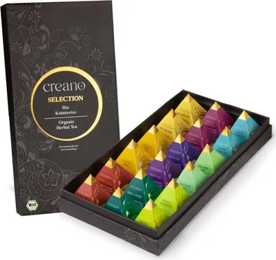 A box of assorted herbal tea bags, with the box partially open to reveal the pyramid-shaped tea bags arranged inside.