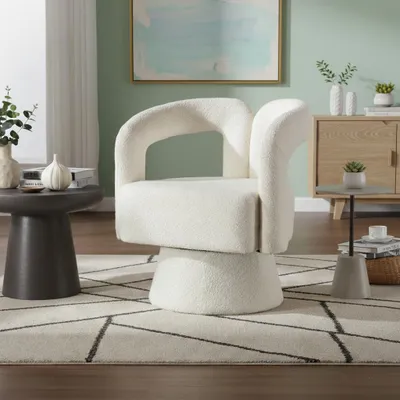 A modern living room setting with a beige armchair as the focal point.