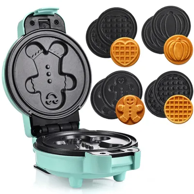 A teal colored mini waffle maker with multiple interchangeable waffle plates, and several finished waffles in different shapes.