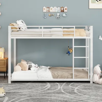 A white metal bunk bed in a child's room with decorative items on the wall and stuffed animals on the beds.