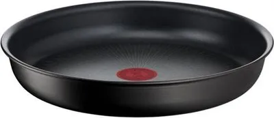 A black frying pan with a red indicator in the center, isolated on a white background.