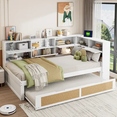 A bedroom scene featuring a white daybed with a pull-out trundle, integrated shelving, and decorative items.