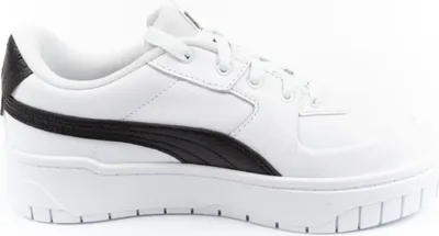 A side view of a white Puma sneaker with a black stripe.
