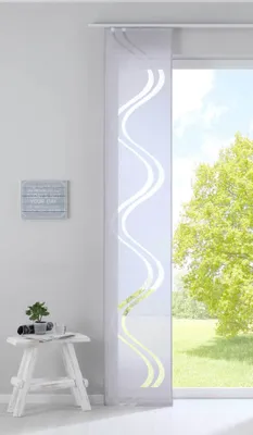 A white panel curtain with a gray wavy pattern hangs in front of a window with a green tree outside.