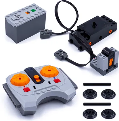 A collection of LEGO Power Functions components laid out on a white background.