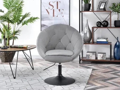 A modern living room setting with a chair and side table.