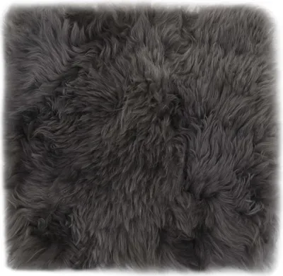 A close-up, top-down view of a grey sheepskin cushion.