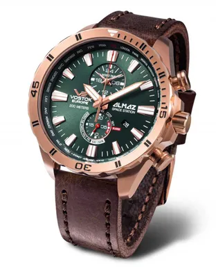 A close-up studio shot of a Vostok Europe Almaz Space Station watch with a green dial and a brown leather strap.