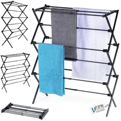 A collage of images showing a black metal drying rack in different configurations and with towels draped on it.
