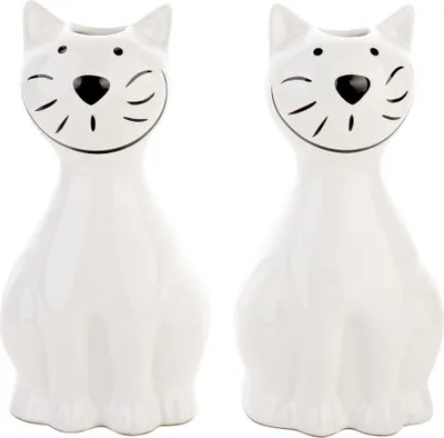 Two white ceramic cat-shaped humidifiers are shown side-by-side against a white background.