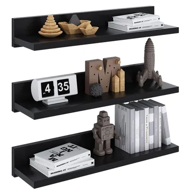 Three black shelves mounted on a white background, each displaying various decorative items and books.