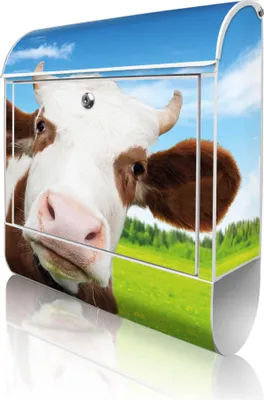 A mailbox with a cow image on it, set against a background of a green field and blue sky.