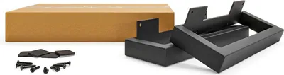 A cardboard box and furniture feet are laid out on a white background.