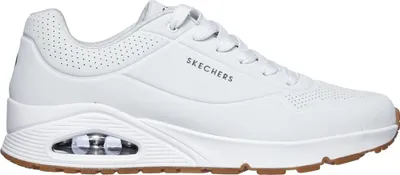 A white Skechers Uno Stand On Air sneaker with a gum sole is shown from the side against a white background.