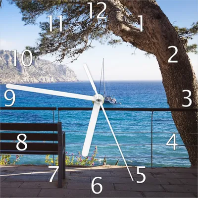 Produktbild von Wallario Design Wanduhr Einsame Bank am Meer - Spanien im Sommer aus Echtglas, Größe 20 x 20 cm