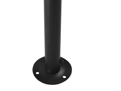 A close-up of the base of a black metal pole with a circular flange attached to the bottom, showing screw holes.