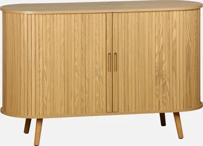 A light wood sideboard with two doors and four legs against a white background.