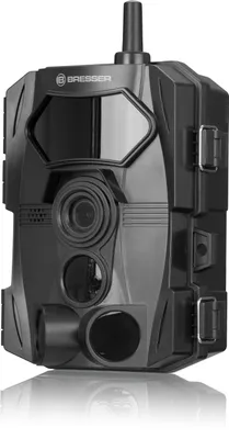 A black trail camera with a reflective surface on the bottom.