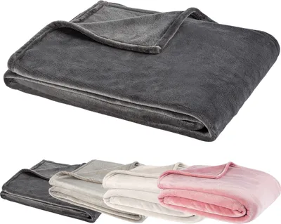 A folded blanket is shown in the foreground, with a row of folded blankets in different colors in the background.