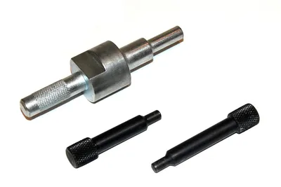 A set of automotive engine timing tools on a white background.