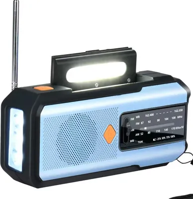 A light blue and black emergency radio with a flashlight and a light bar on top.