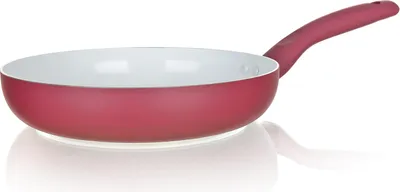 A red ceramic frying pan with a white interior is shown against a white background.