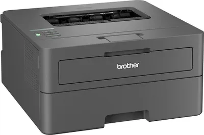 A dark gray Brother laser printer is shown from a front-side angle on a light gray background.