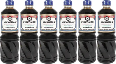 Six bottles of Kikkoman Tamari Gluten-Free Soy Sauce are lined up against a white background.