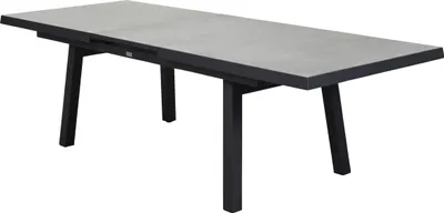 A rectangular dining table with a gray tabletop and black legs, shown from a slightly elevated side angle against a white background.