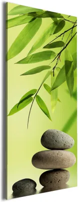 Produktbild von Wallario Premium Leinwandbild Steinstapel im Grünen in Größe 30 x 75 cm