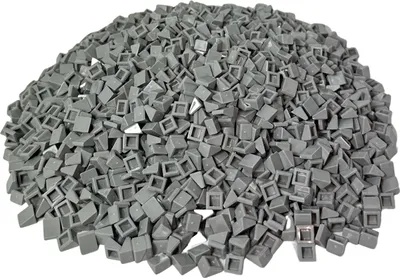 A pile of small, gray, LEGO-like building blocks.