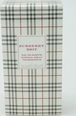 A close-up shot of a Burberry Brit perfume box with its signature plaid pattern.