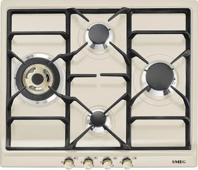 A top-down view of a cream-colored gas stovetop with black grates and burners.