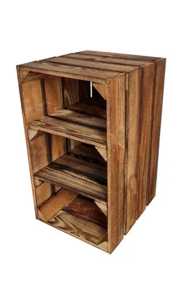 A wooden shelving unit made of crates, standing on a white background.