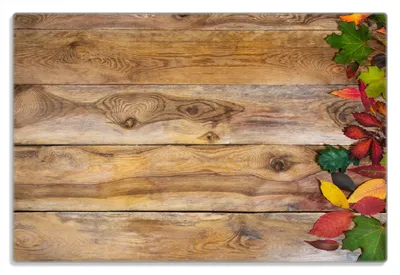 Produktbild von Wallario Frühstücksbrettchen aus Glas 20 x 30 cm mit rutschfesten Füßen, Motiv Herbstlaub auf Holzbrettern