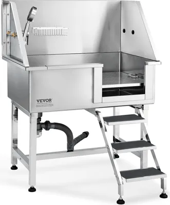 A professional stainless steel dog grooming tub with a built-in ramp and shower head, shown on a white background.