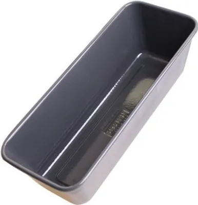 An empty loaf pan shown from a diagonal angle against a white background.