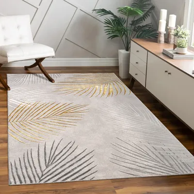 A living room scene featuring a rug with a leaf pattern, a chair, and a cabinet.
