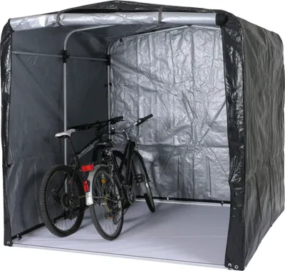 Two bicycles are stored inside a portable garage structure.