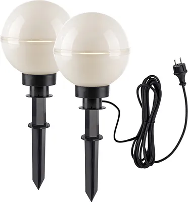 Two white globe-shaped garden lights with black stakes and a black power cord with a European plug.