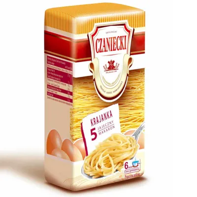A product shot of a box of Czaniecki egg noodles, with a close-up of the noodles on a spoon.