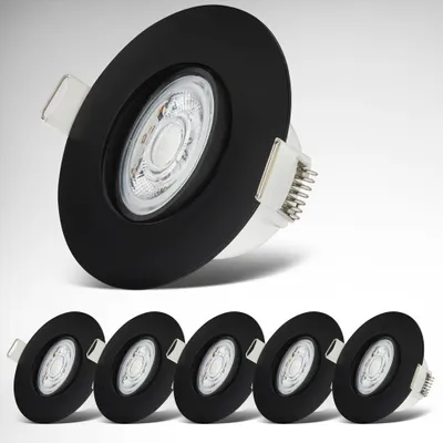 A group of black recessed LED spotlights on a light gray and white background.