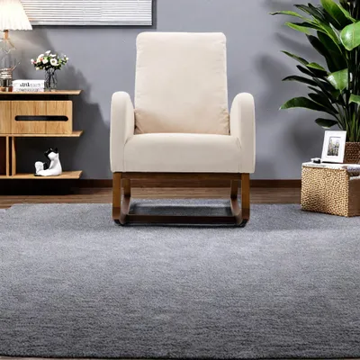 Image de Fauteuil à bascule beige en tissu éponge avec coussin, dossier haut et accoudoirs – design moderne et confortable